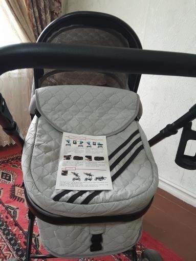 Продам Б/У Много функциональная коляска  и электронная люлька  .