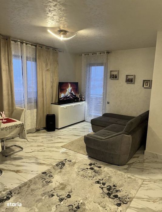 Apartament 59 mp utili+terasa de 18 mp,parcare subterana,centru Gilau
