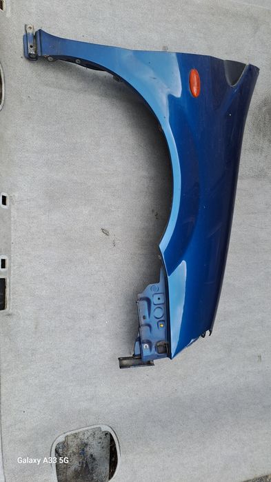 калник Nissan Almera Tino  2000-2006