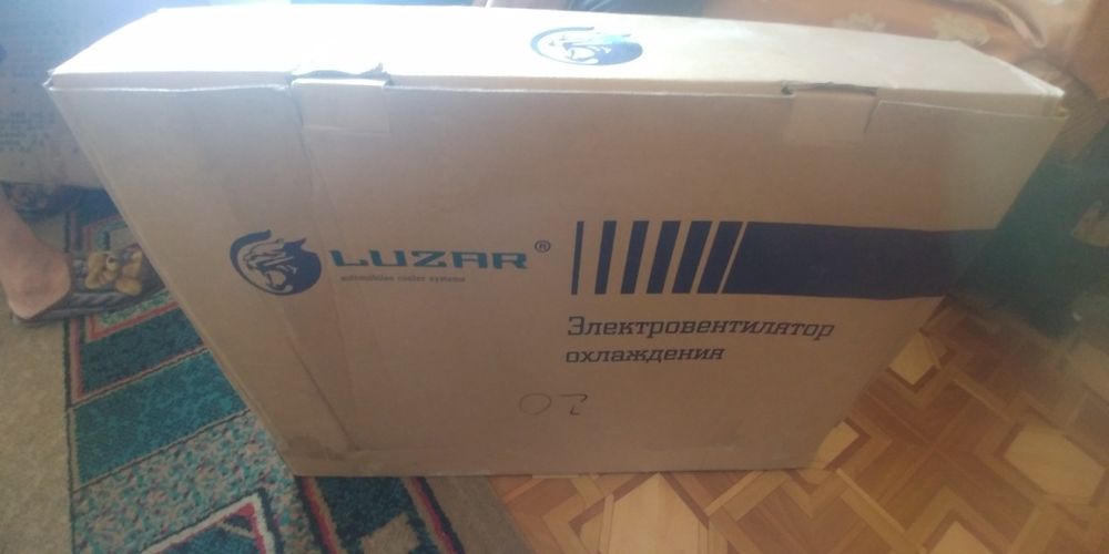 Вентилятор в сборе на логан 1