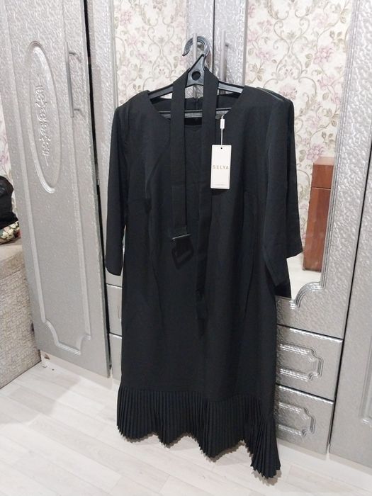 Женский платье новый.