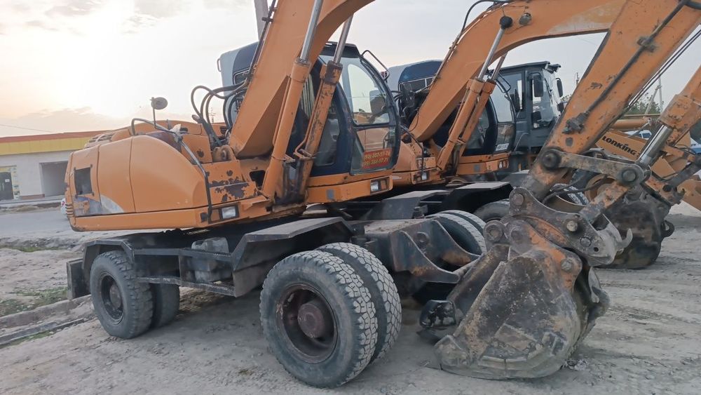 Экскаватор хизмати