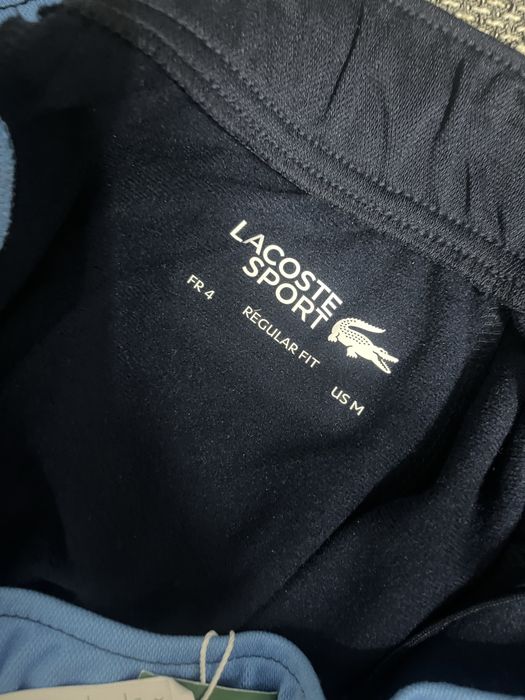vand pantaloni lacoste