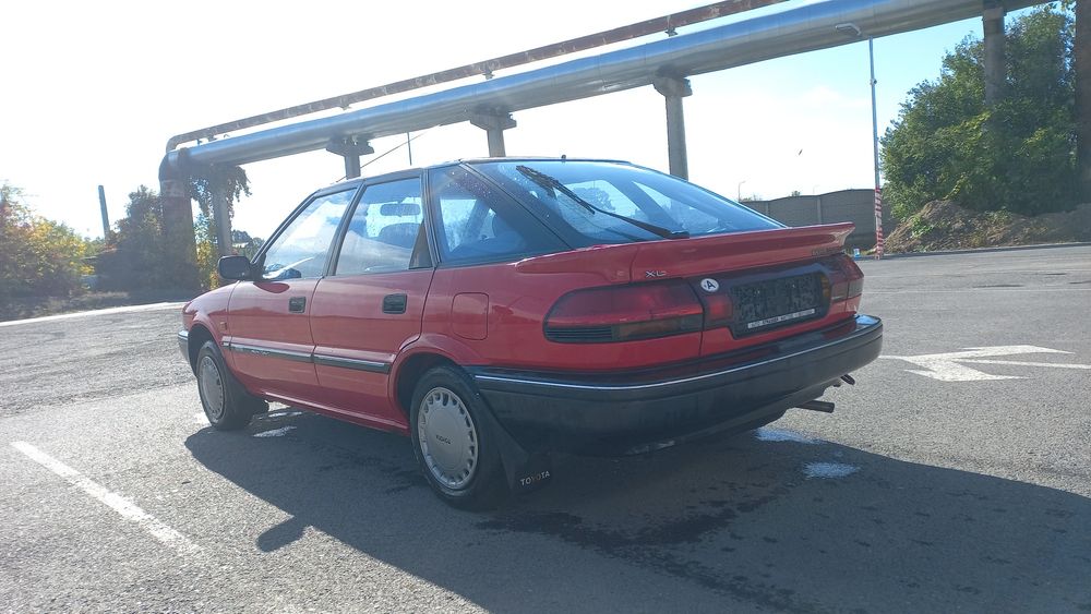 Toyota corola  13 benzina  100 mi km de garaj fără rugina