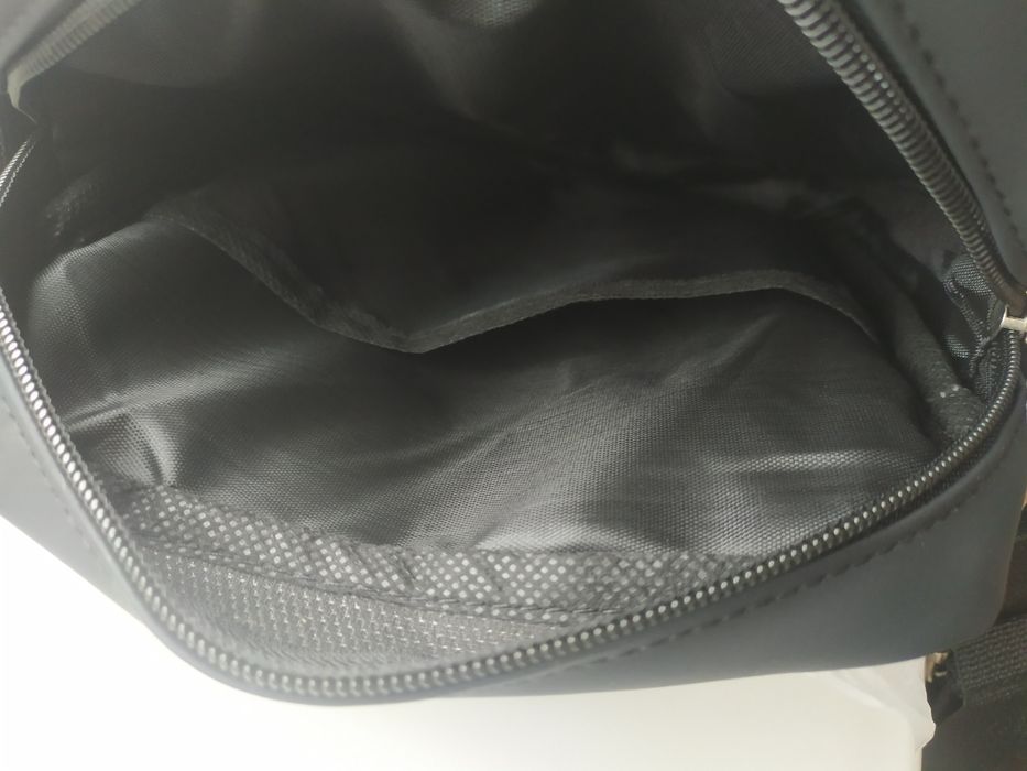 Продам Барсетку ,черная.