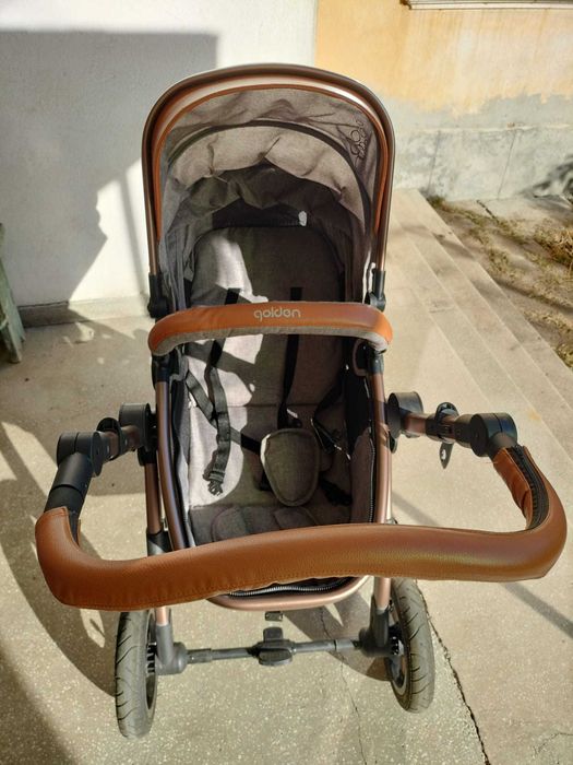 Cărucior și scoica bebe