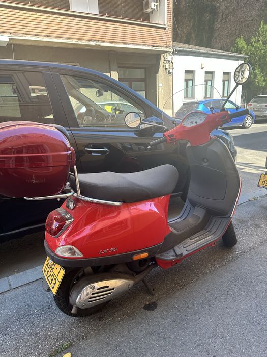 Scuter Piaggio Vespa LX-50 rosu, cu kit Mallossi fara limitator (70 km/h), topcase si parbriz