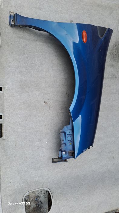 калник Nissan Almera Tino  2000-2006