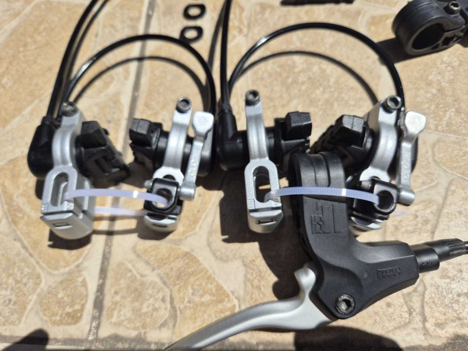 Set frane hidraulice Magura HS11-EVO2, inclusiv 2 perechi saboti noi