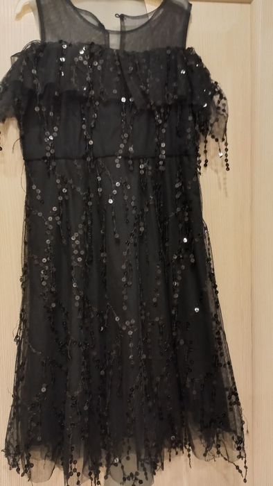 Продам платье  на десочку новое.Рост 130см