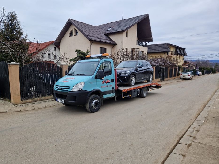 Platforma Iveco cu macara și troliu