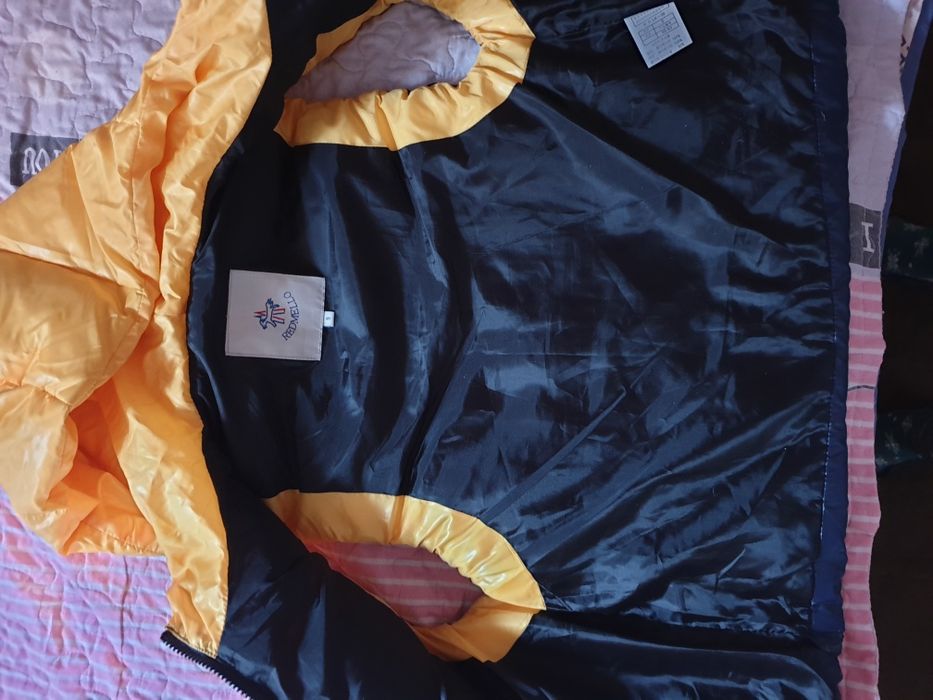 Пуховая жилетка новая