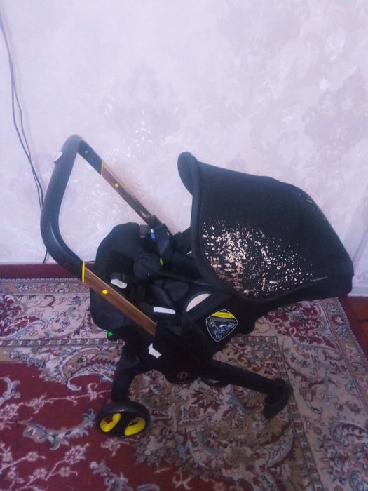 Срочно Коляска плюс автокресло Донна сотилади!
