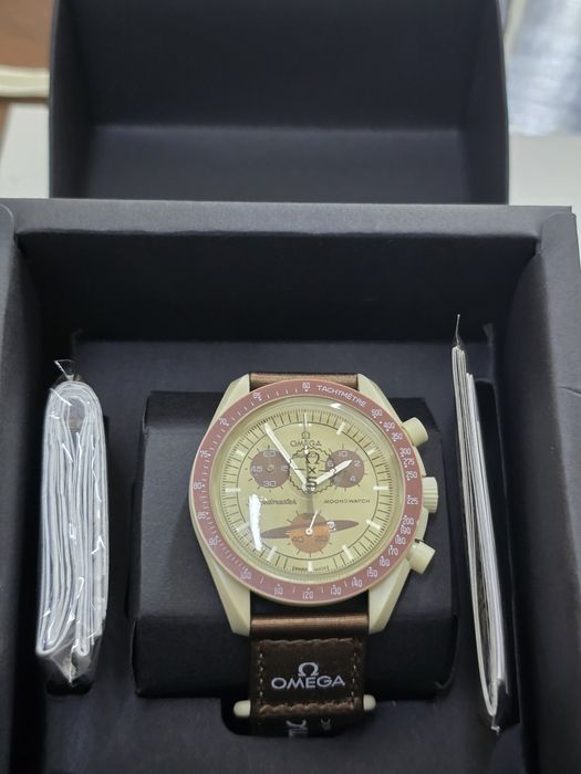 Swatch omega mission to люкс