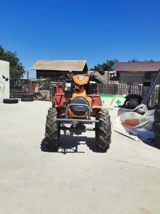 Motocultor O'MAC MC 12000E-D echipat cu remorca foarte incapatoare cu frana de picior