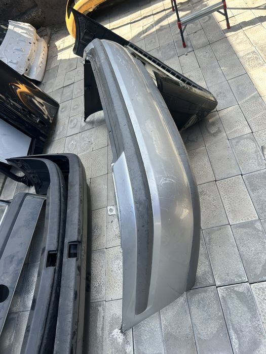 Задний бампер Мазда 626 птичка