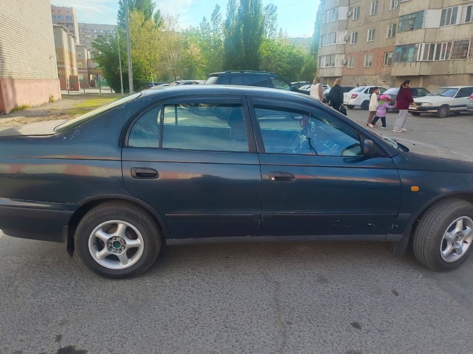Тайота карина Е