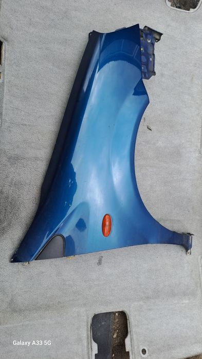 калник Nissan Almera Tino  2000-2006