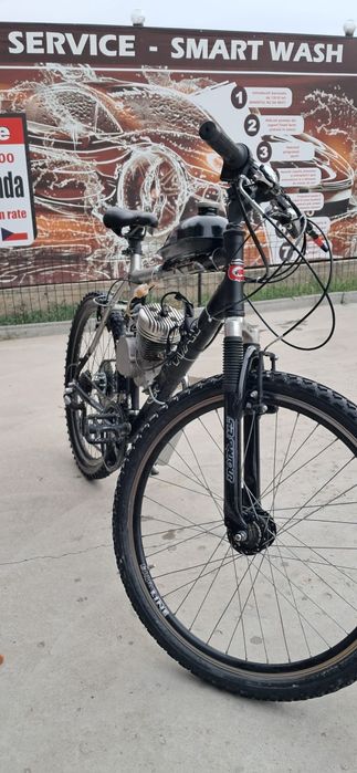 Vând bicicleta cu motor 80cc in 2 t