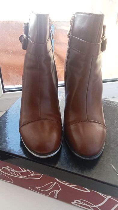 Продам новые сапоги