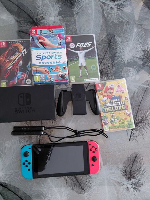 Nintendo switch impreuna cu 4 jocuri