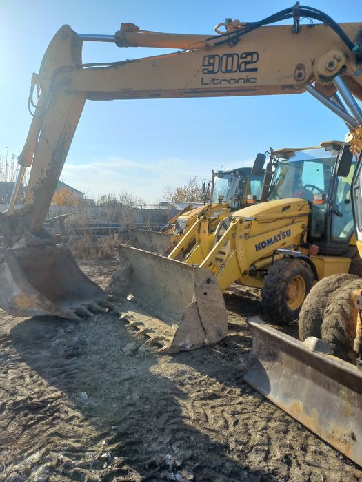 Услуги экскаватора-погрузчика