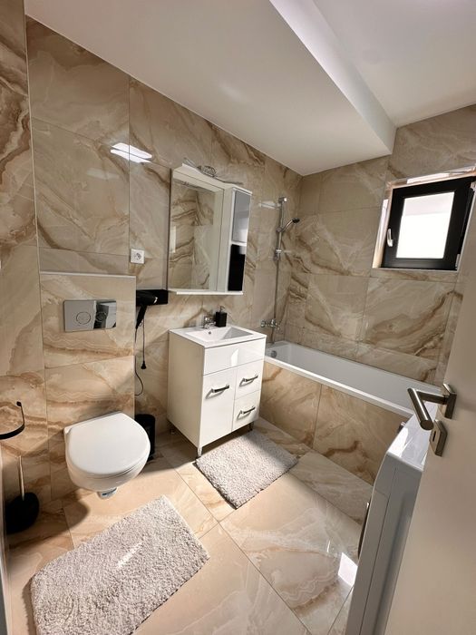 Apartament cu 2 camere , nou, mobilat, utilat , prima închiriere