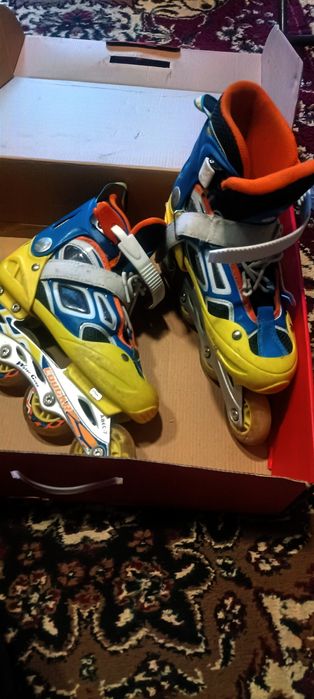 Коньки роликовые