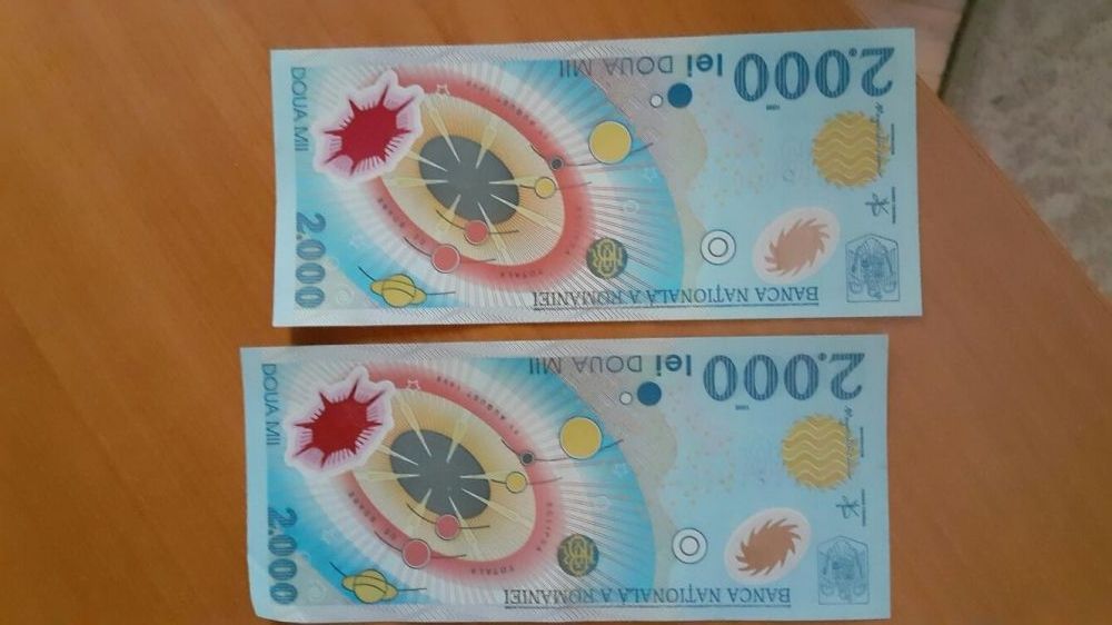 Vand bancnote de 2.000 lei cu eclipsa