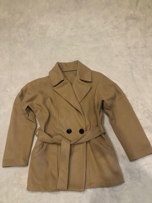 Елегантно палто, обличано два пъти за поводи