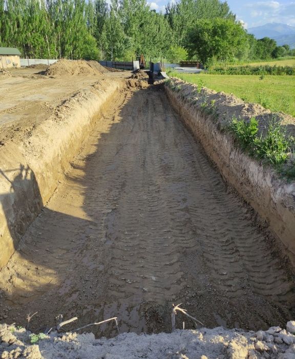 Услуга эксковатора-погрузчика