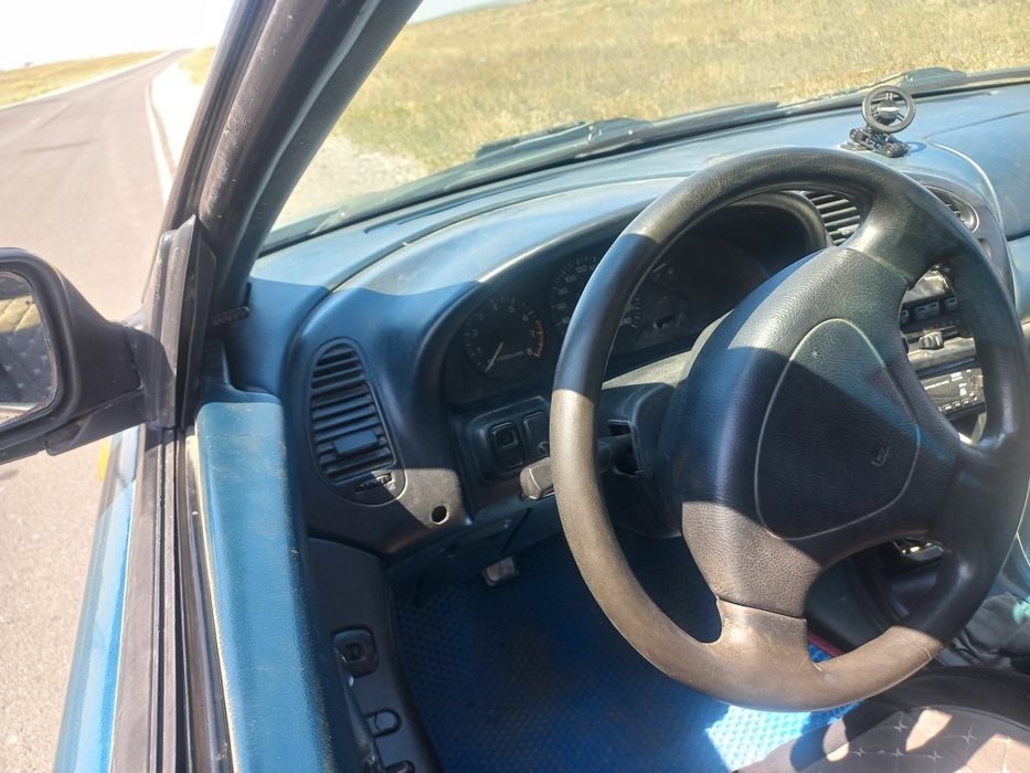 Мазда323F 95г бензин