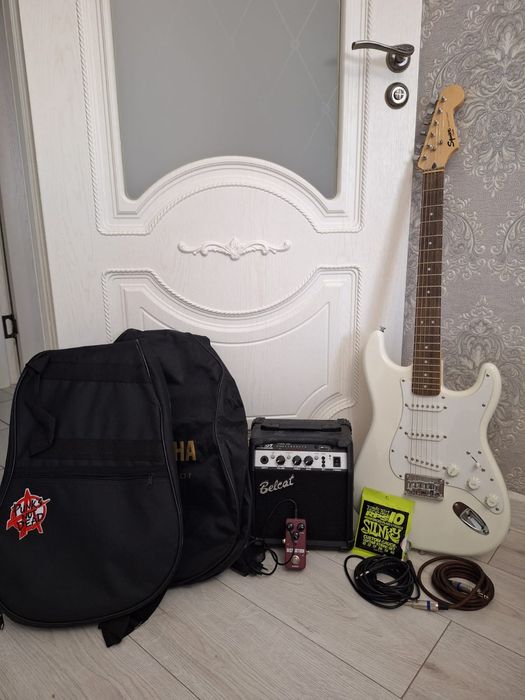 Гитара в наборе + струны в подарок!