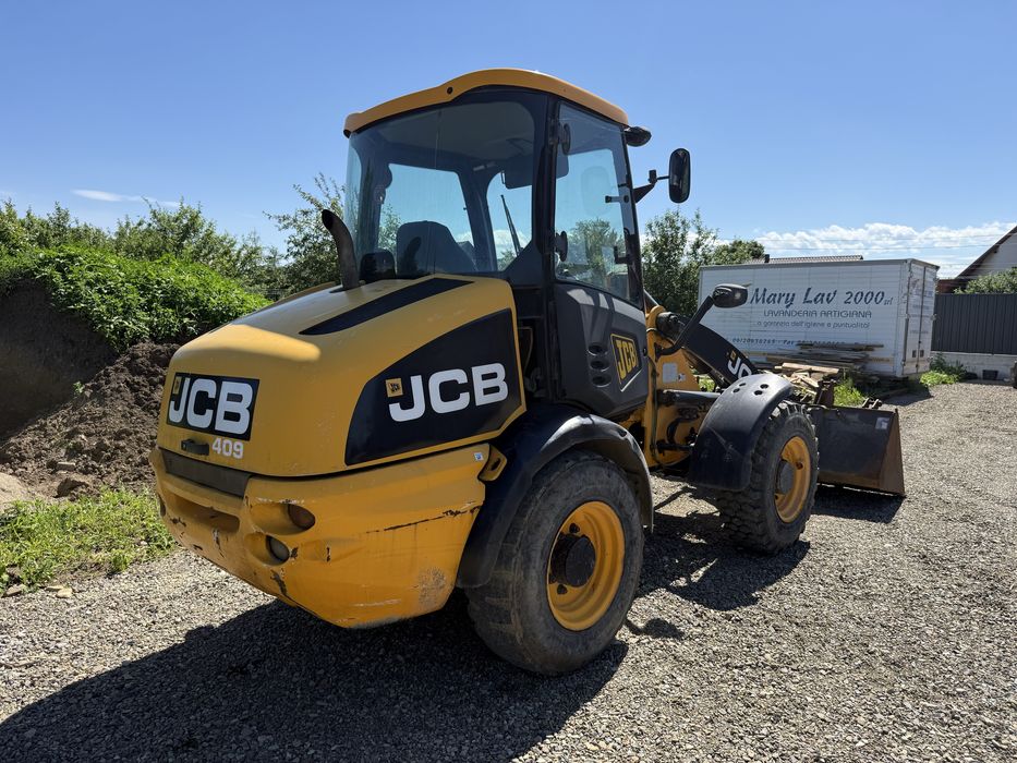Jcb 409 vola incarcator frontal  furci cupa volvo