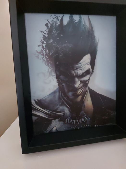 Една картина с два сменящи се  лица -на Жокера и Батман