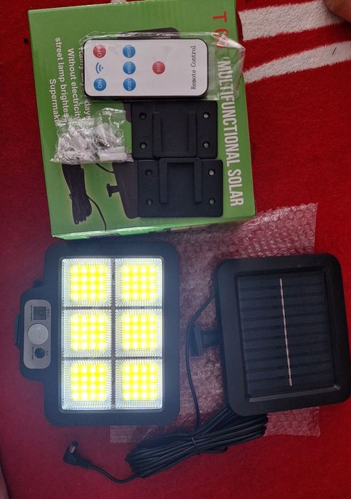 Set 2 bucăți lămpi solare cu fir si senzor de mișcare,  firul are o lungime de aproximativ 5 metri.