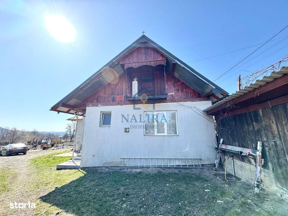 Casa de caramida de vanzare Surdesti cu teren intravilan 5000mp