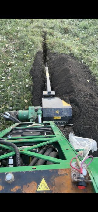 Услуги траншеекопателя бара . Прокладка кабеля.