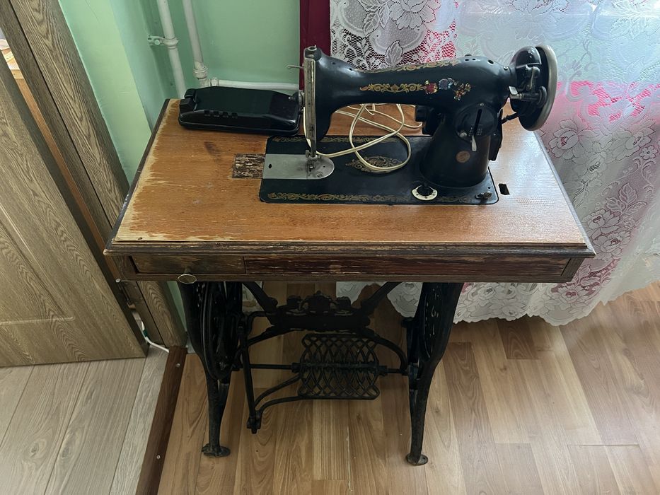 Vind Mașină de cusut Sunger.