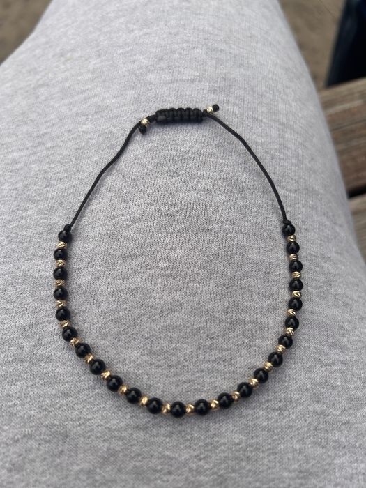 bratara snur negru cu bile de aur 14K si pietre onix negre