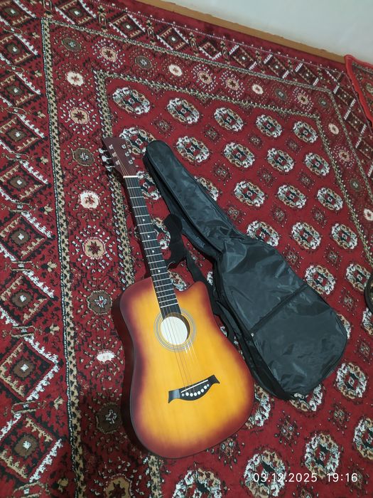 Гитара сотилоди тозо