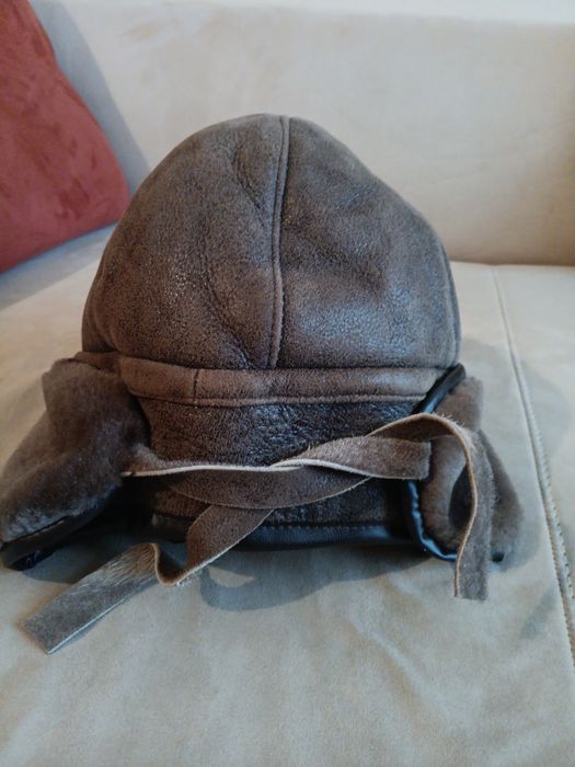 Кожена зимна шапка ушанка. шапка плетена