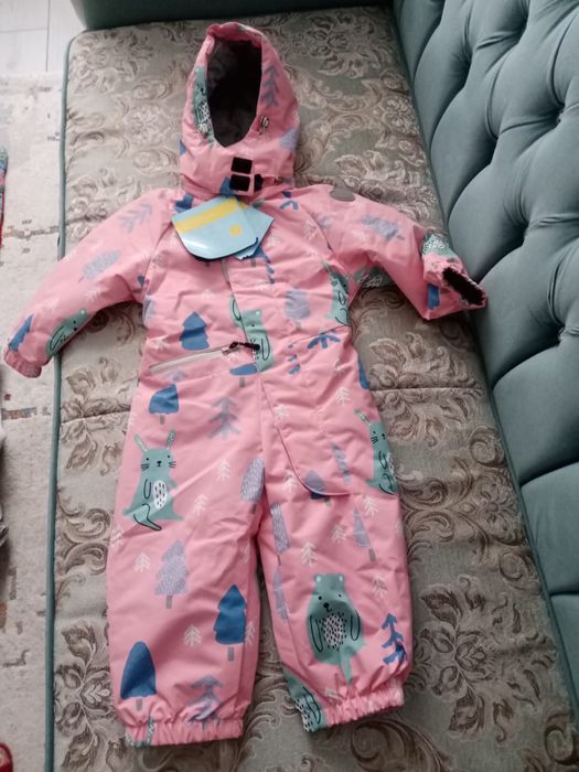 Продам новый комбинезон весна осень