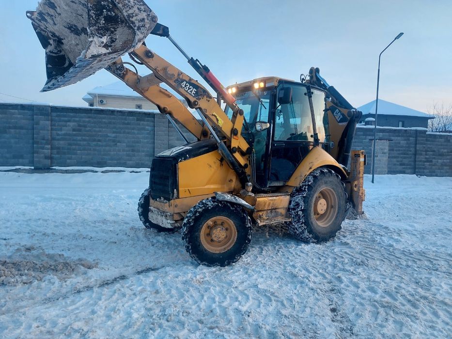 Эксватор-погрузчик 3 в 1