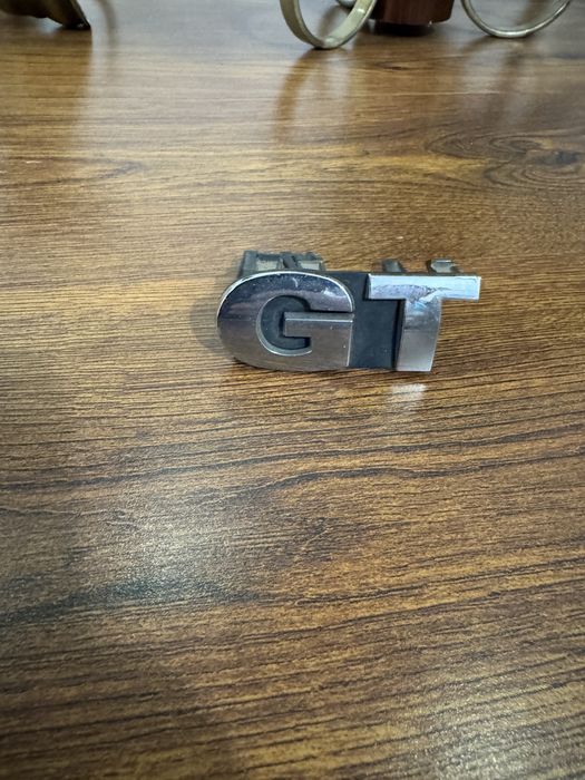 Emblema GT gama vag si 3 capacele jante ( noi)