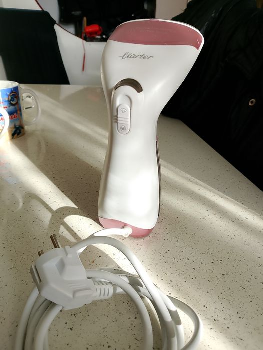 Mașina de călcat vertical cu abur