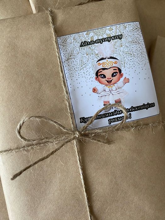 Тойбастарға кітап наклейкамен