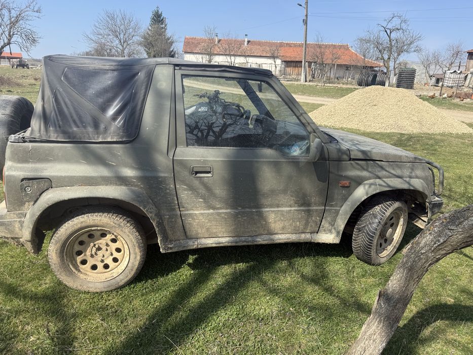 Atv 320 adly nr negre și Suzuki Vitara 1.6 i