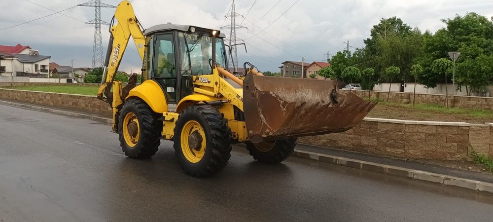 Buldoexcavator Caterpillar 428 F cupa multifuncțional