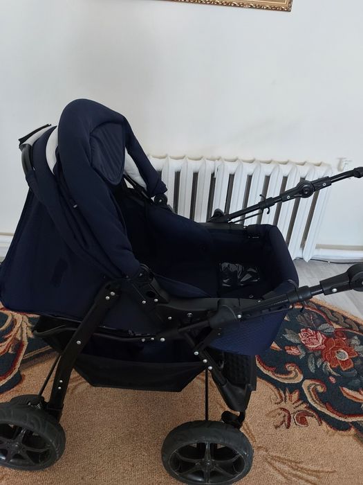 Коляска с регулируемой ручкой